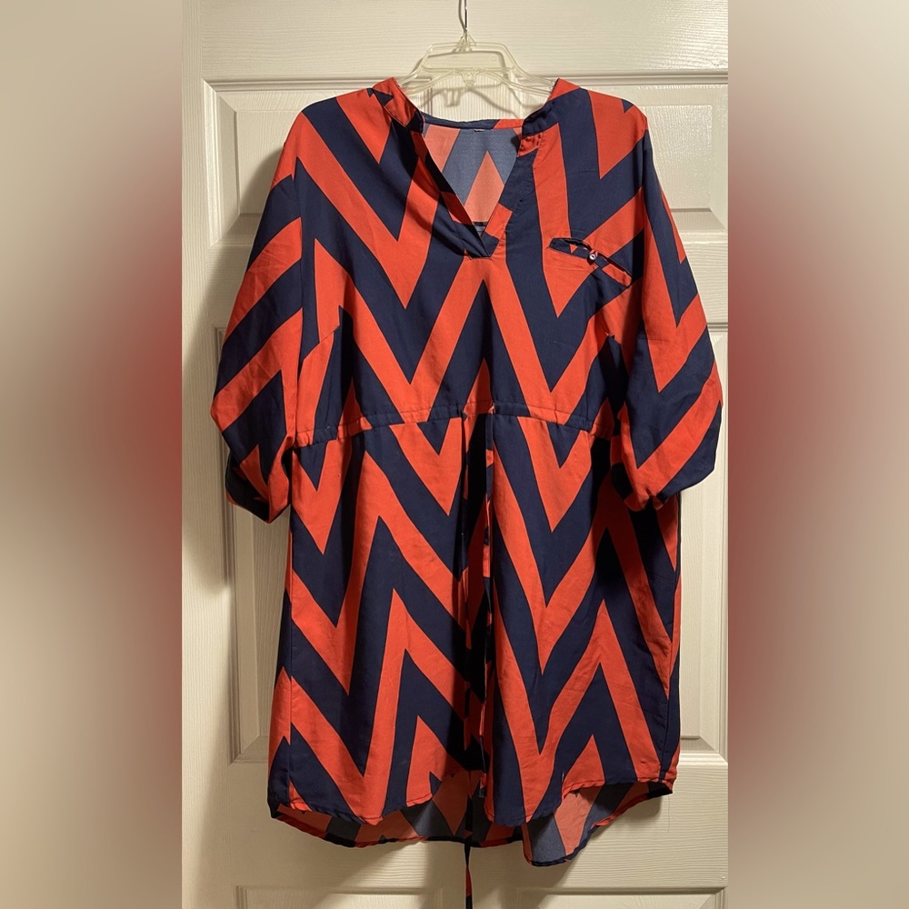 Orange and Blue knee length dress. Adjustable tie in the front.